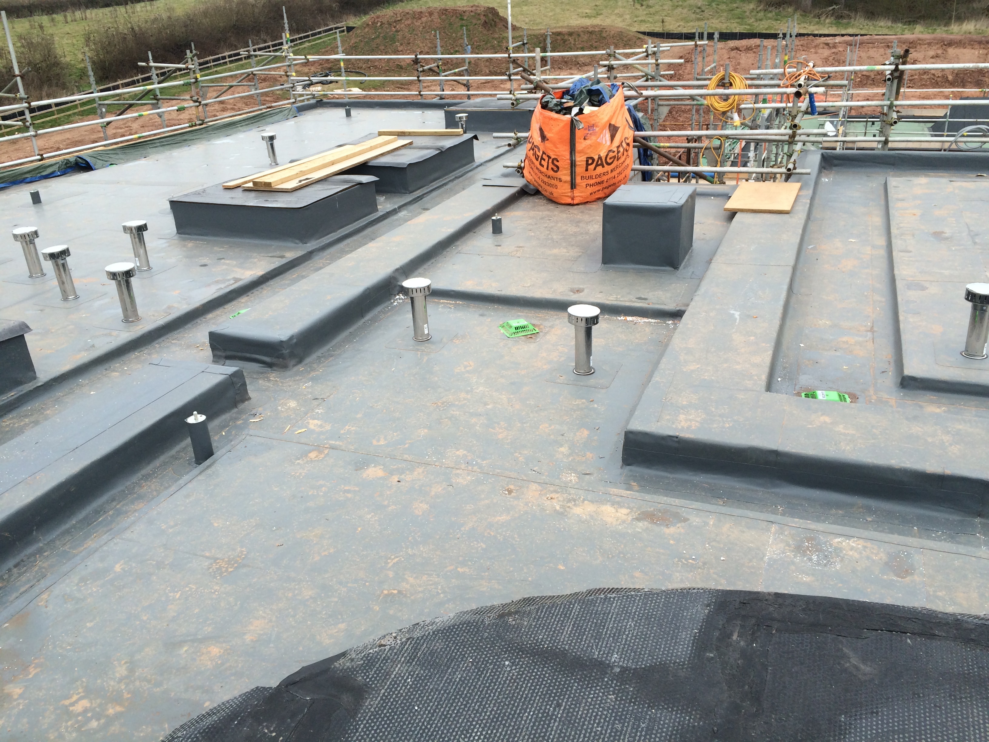 Apex Asphalt roofing team on a commercial rooftop